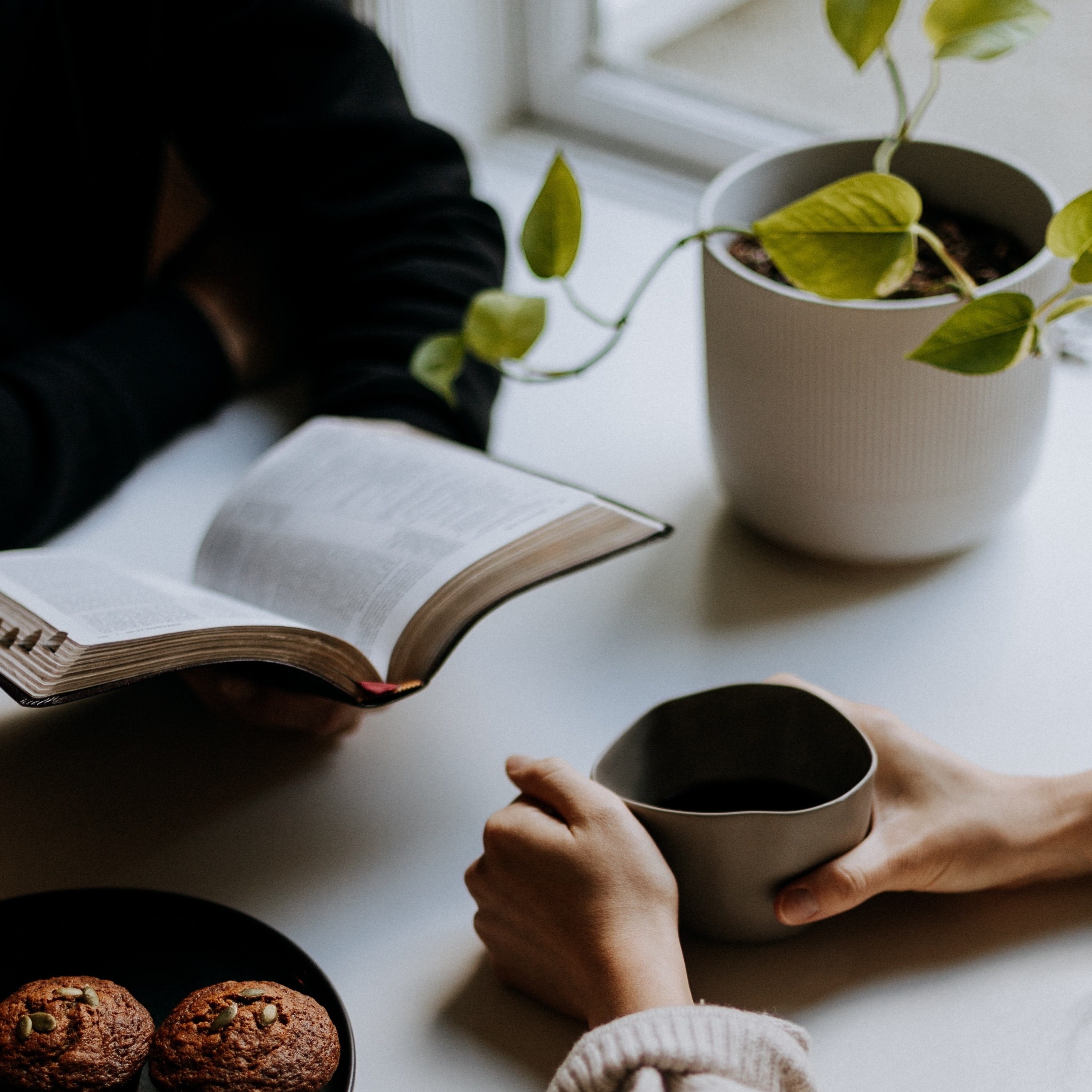 Photo of hand drinking coffee